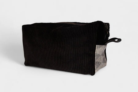 The SB Bag - Espresso Corduroy is a rectangular bag featuring a YKK metal zipper on top and a small fabric loop handle at one end, shown against a plain white background.